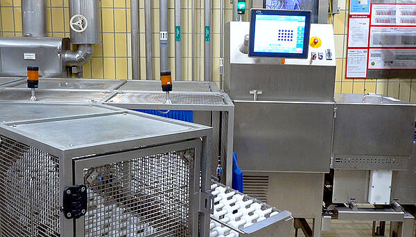 Product inspection of yogurt at Unternehmensgruppe Theo Müller