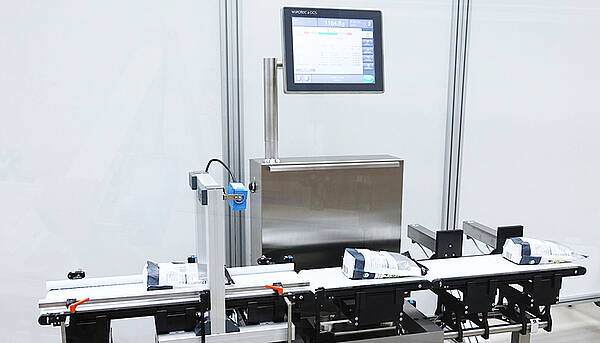 Checkweigher with integrated barcode scanner
