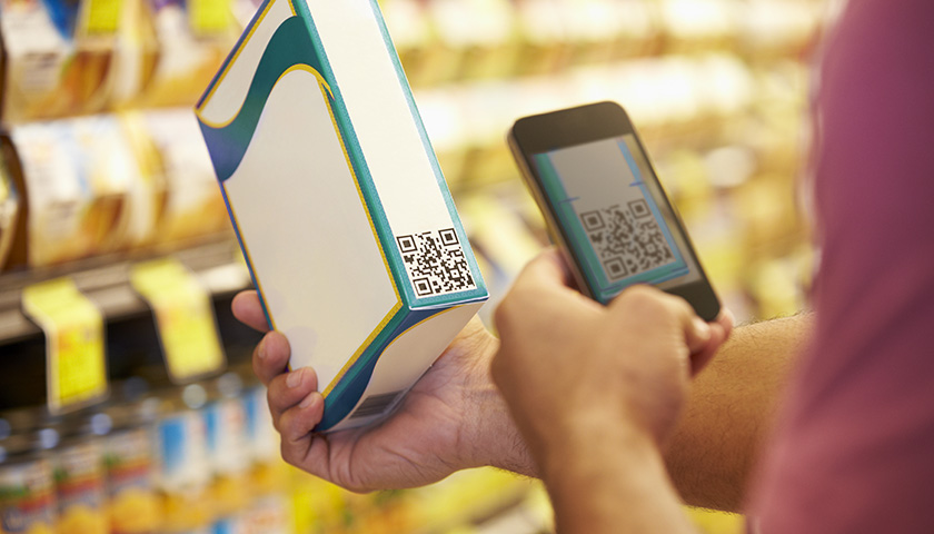 Scanning a packaging barcode to detect food fraud
